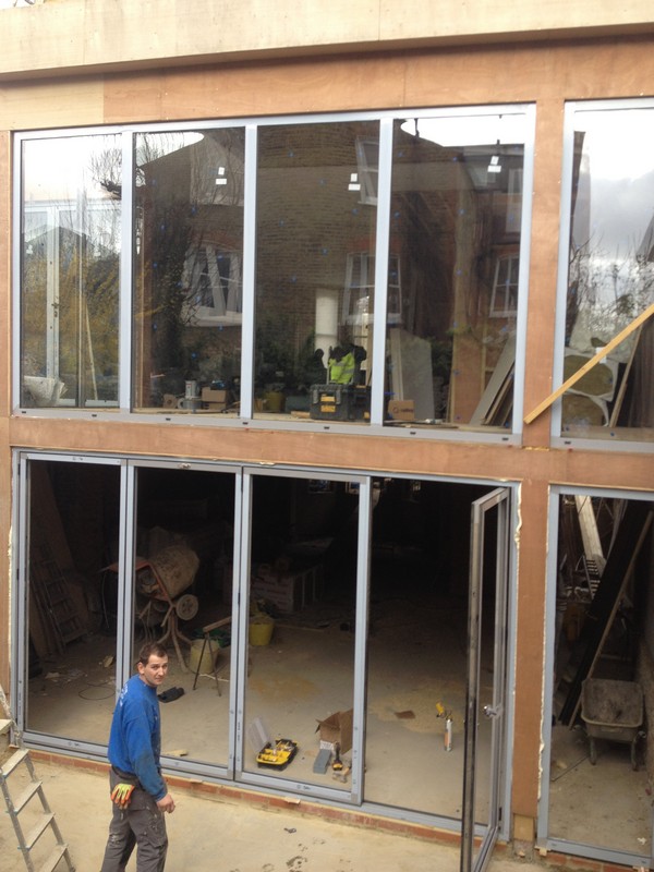 Aluminium bi-fold doors with two-storey glazing in Isleworth