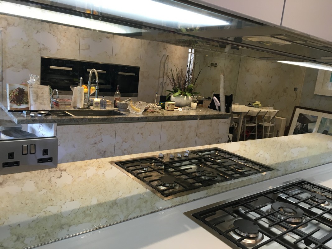 Mirror glass splashback in Isleworth luxury kitchen