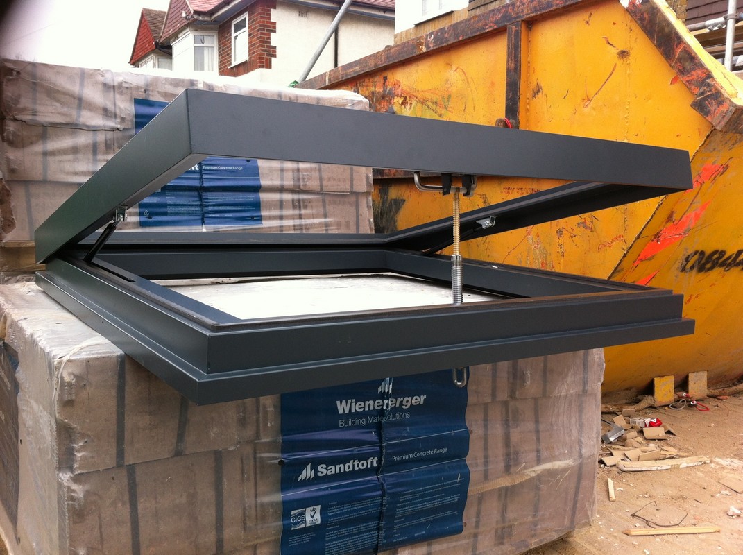 Opening flat roof skylight in anthracite grey installed in Isleworth